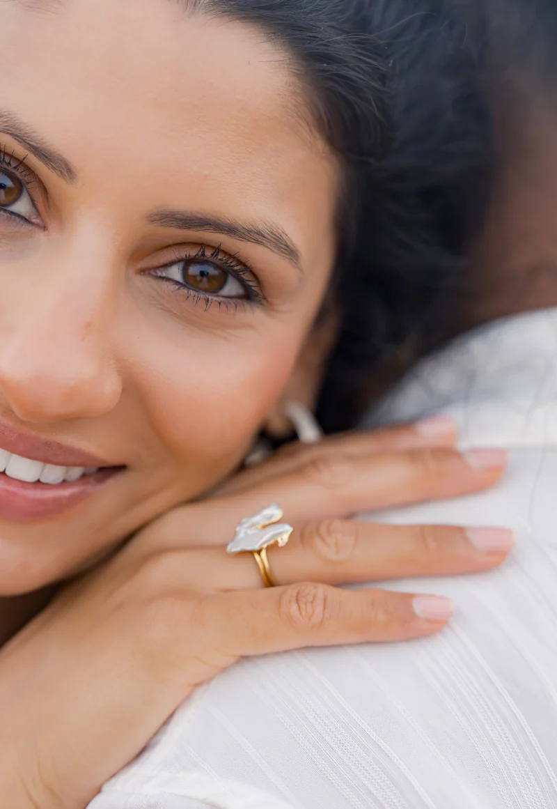 Close-up of a smiling bride with a ring on her hand